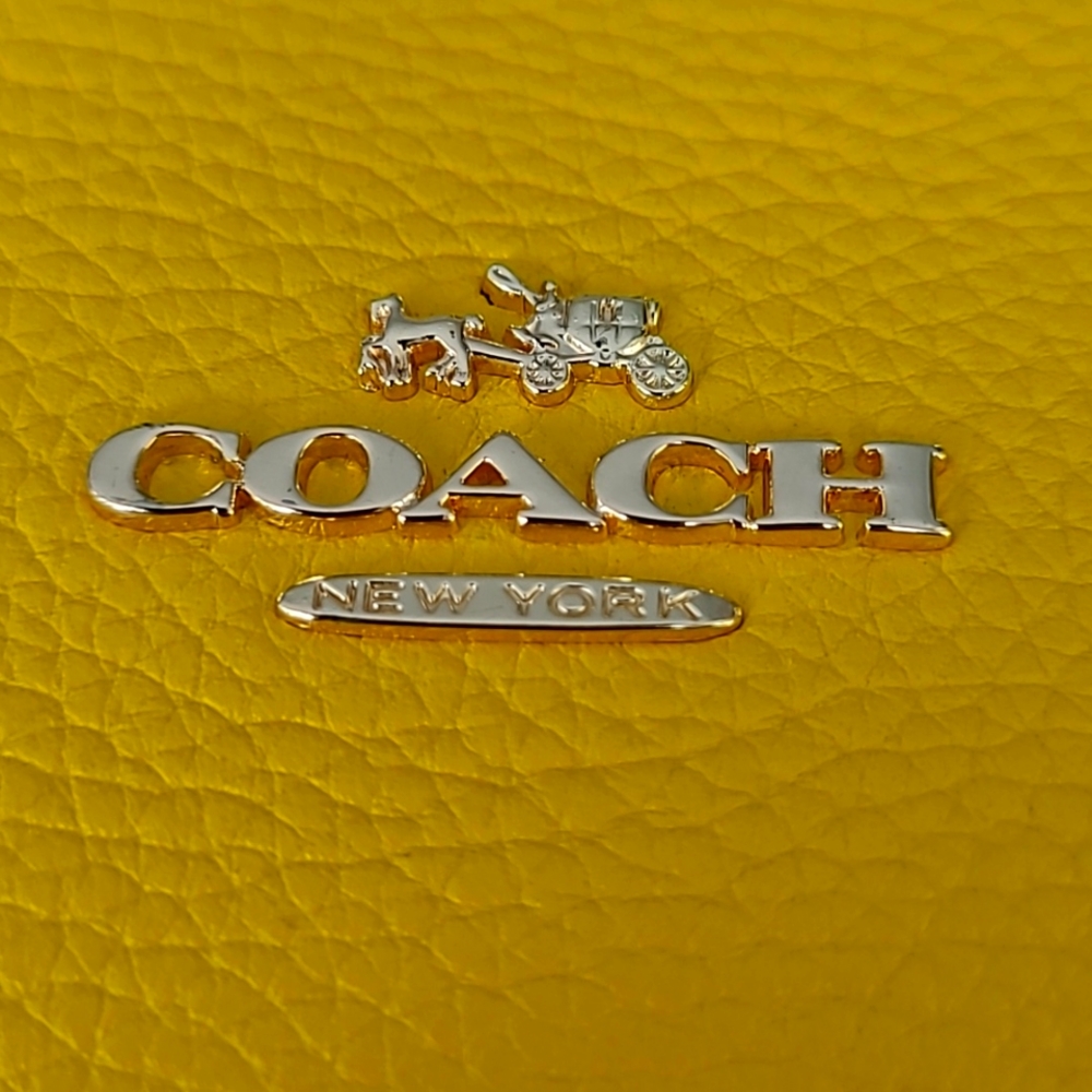 Coach handbag in yellow and white